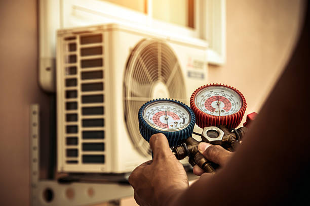 Professional Heat Pump Repair technician working in Ekron, KY